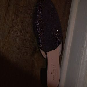 A glittery black flat